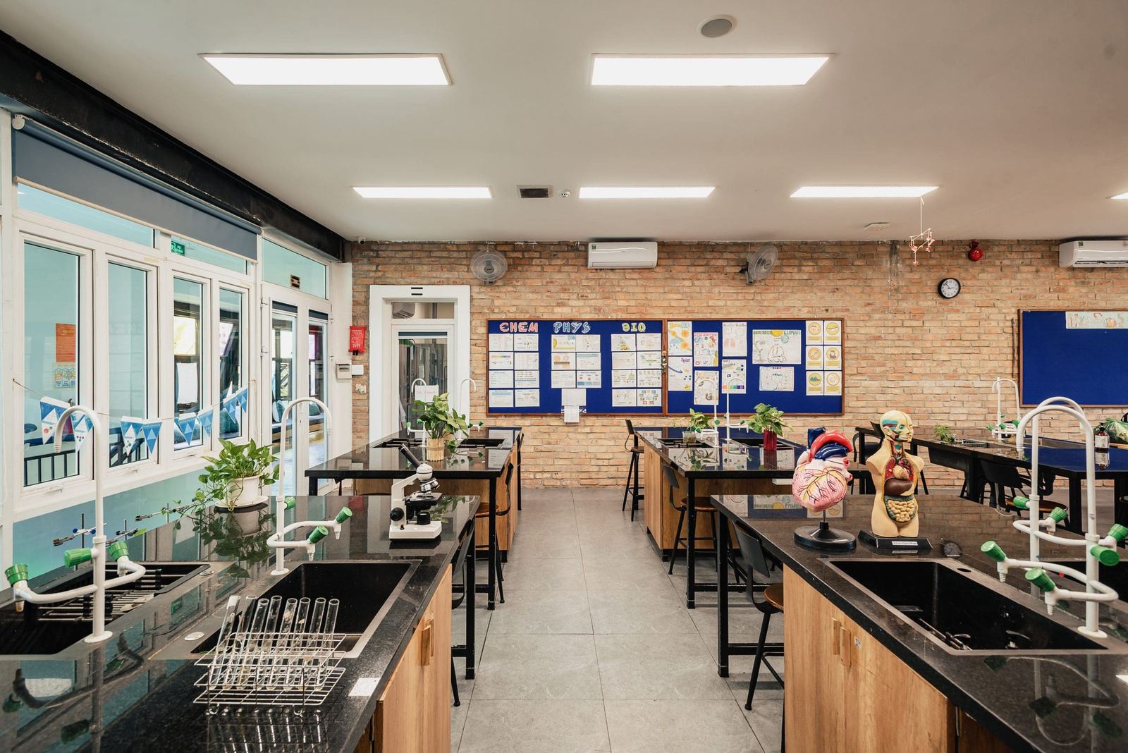The science laboratory, with benches, sinks and microscopes
