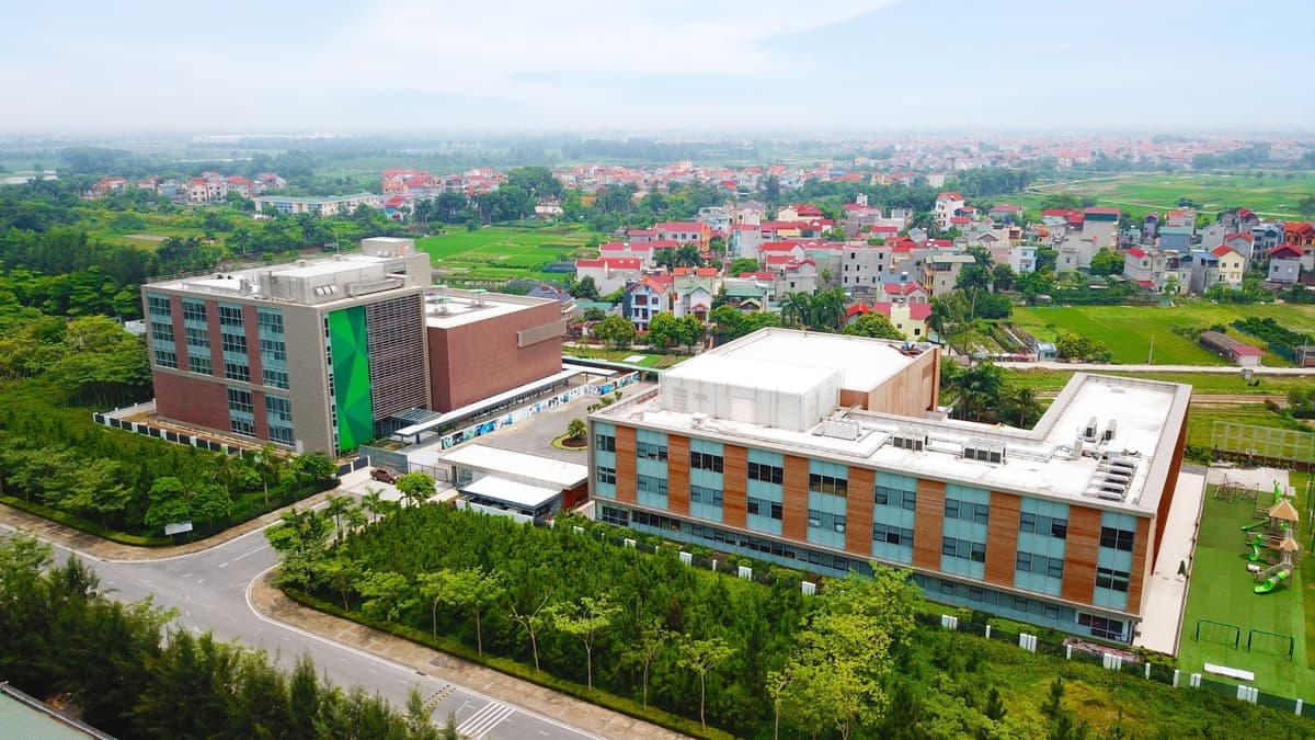 An aerial view of the Concordia International School Hanoi campus buildings and grounds