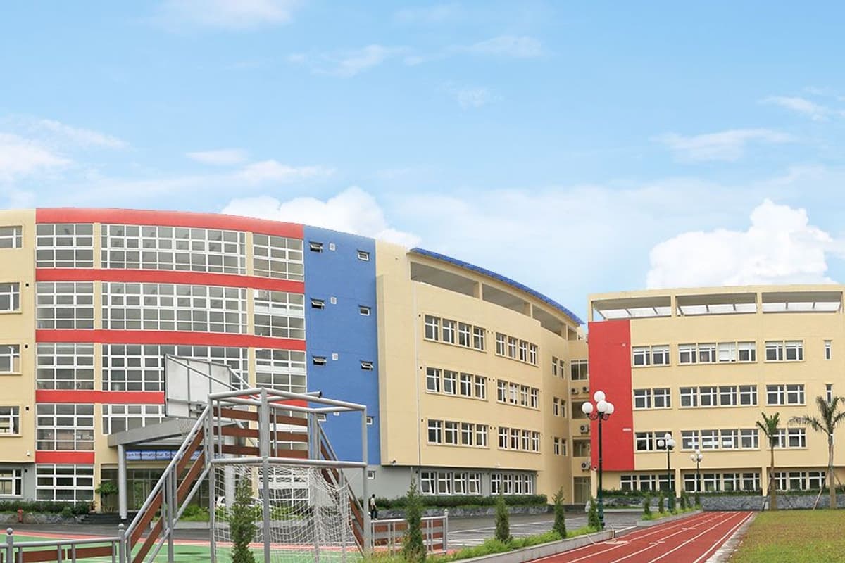 The colourful teaching buildings and running track of the Korean International School in Hanoi